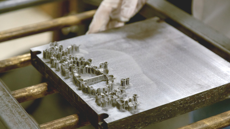 Denture parts fresh out of 3D powder metal printer