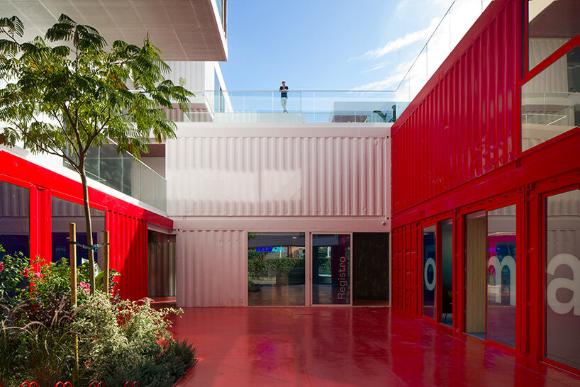 reused shipping containers form high-tech incubator by carquero arquitectura in spain