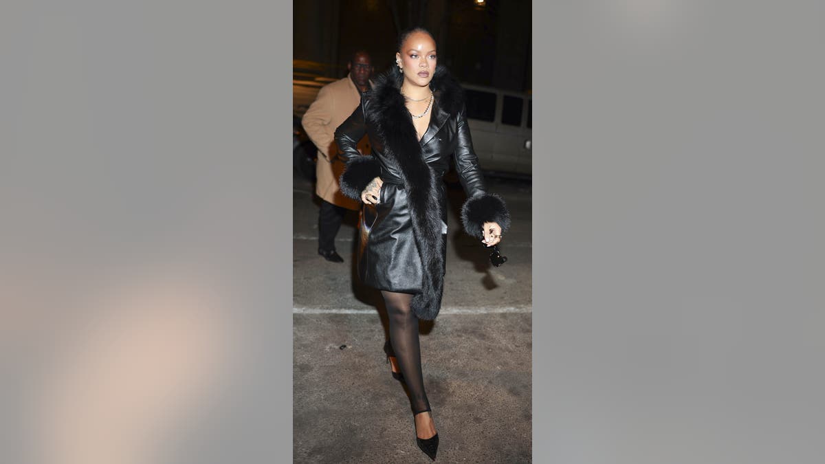 A full-length photo of Rihanna outside Rocky's fashion show