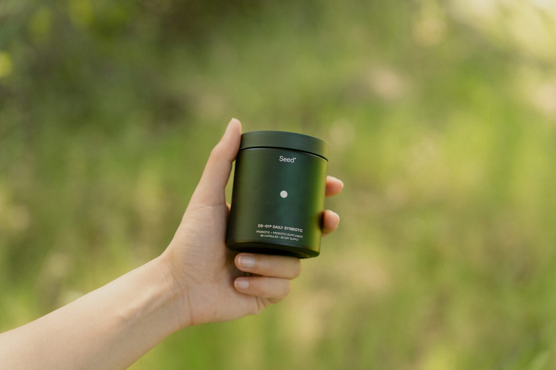 Seed DS-01 Synbiotic being held by woman