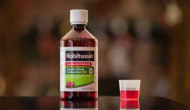 Robitussin bottle on a kitchen counter, representing Robitussin settlement.