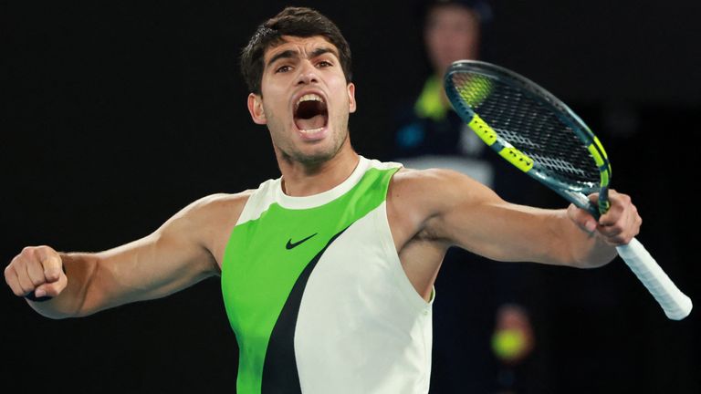 Spain's Carlos Alcaraz reacts after a point against Serbia's Novak Djokovic during their men's singles final match on day fifteen of the Aus