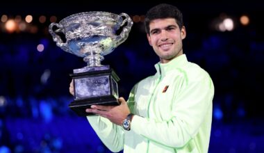 Spain's Carlos Alcaraz poses with the Norman Brookes Challenge Cup after defeating Serbia's Novak Djokovic in the men's singles final on Day