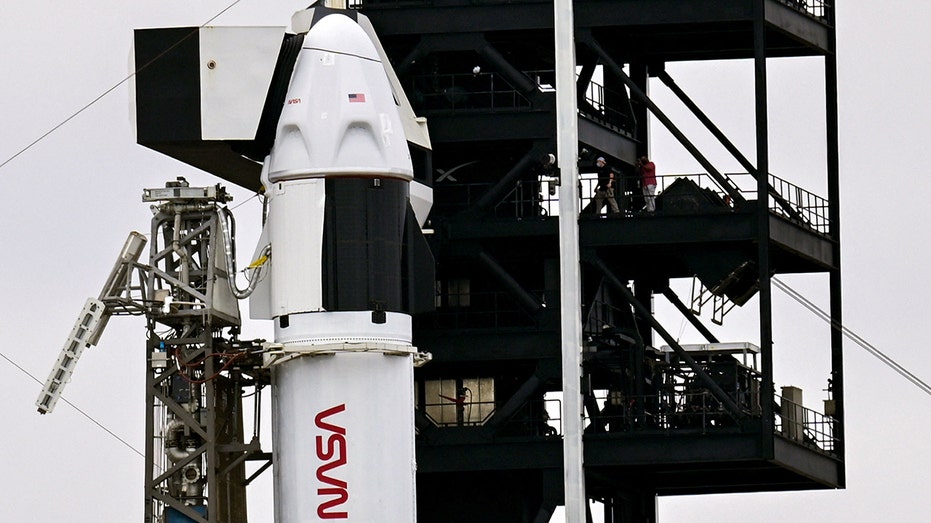 SpaceX Falcon 9 rocket and Dragon spacecraft stands at Launch Complex 40 in Florida