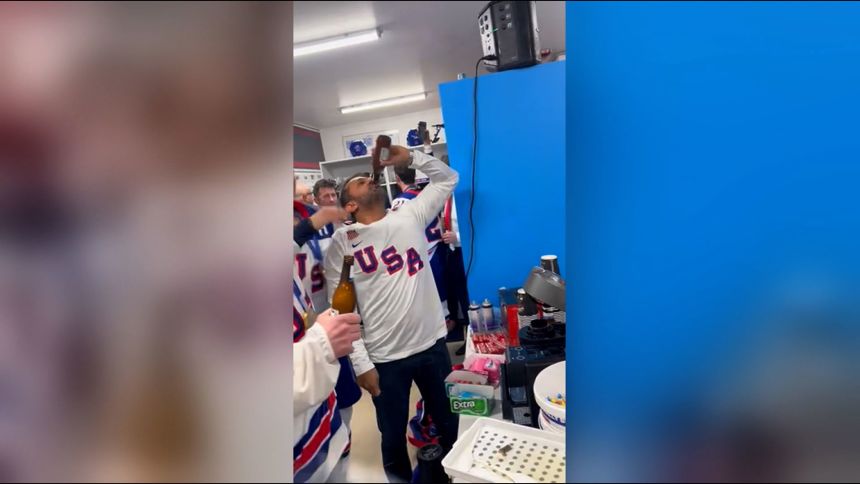 This screengrab taken from a video shows FBI Director Kash Patel celebrating the US men's hockey team's Olympic win in their locker room, in Milan, Italy, on February 22, 2026.