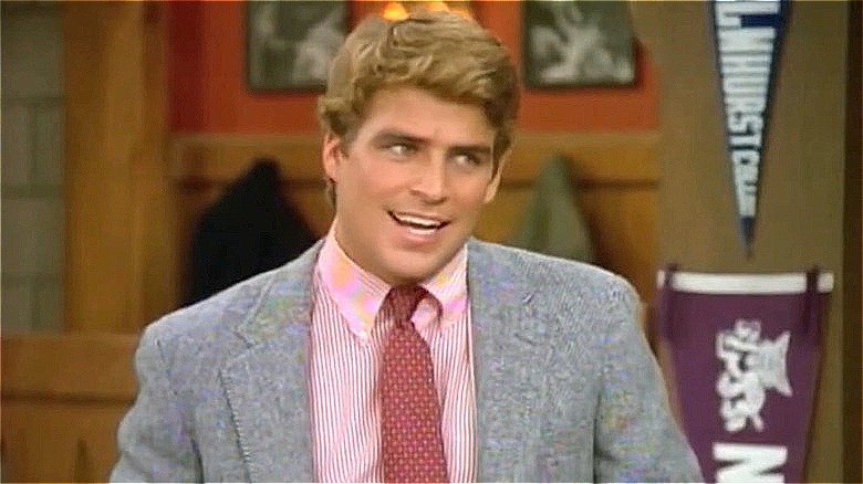 Roger Phillips in gray suit, smiling