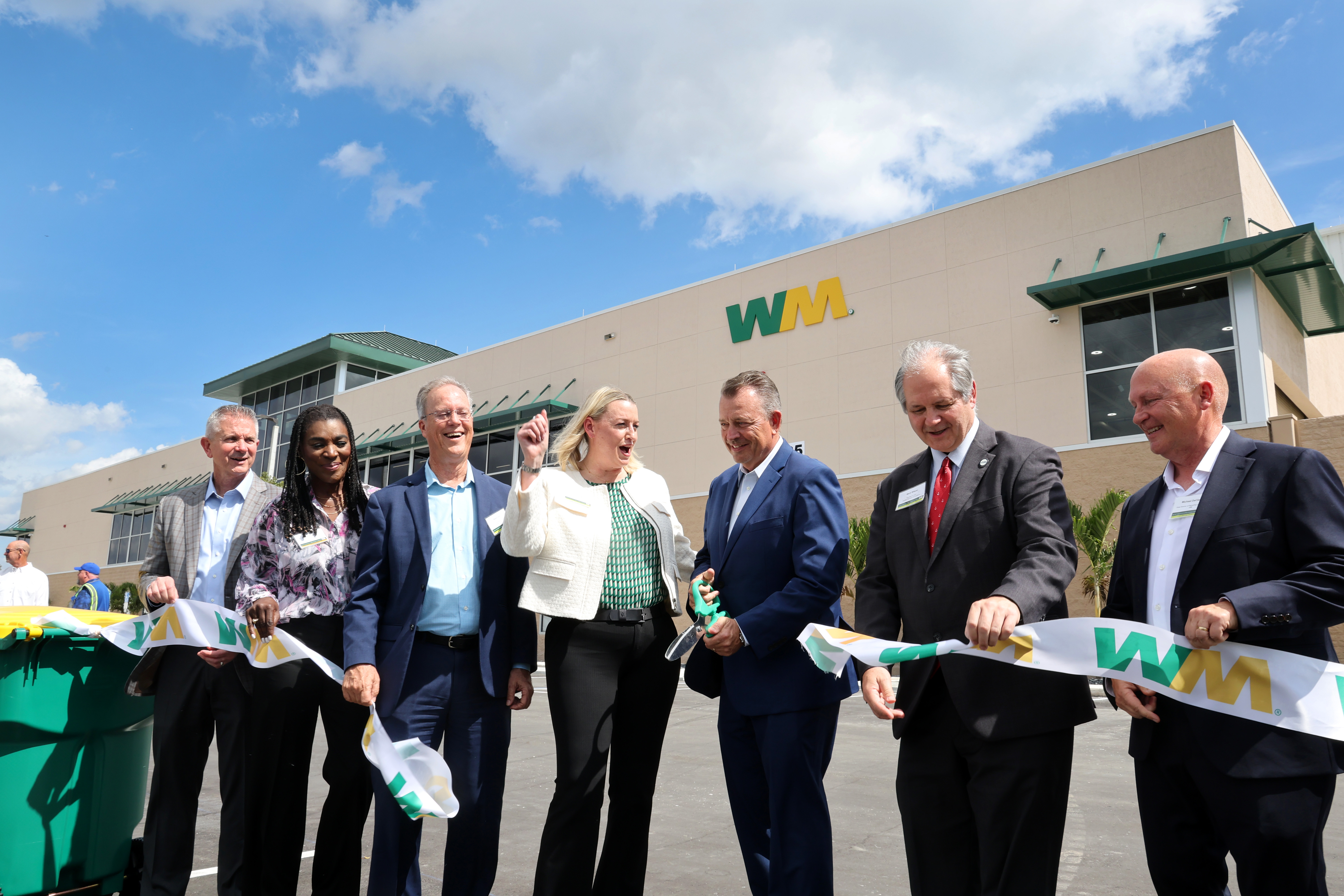 From left, WM Senior Vice President of Operations Chris DeSantis, Broward County Commissioners Alexandra Davis and Beam Furr, WM Chief Sustainability Officer Tara Hemmer, WM Vice President David Myhan, Mark Wilson of the Florida Chamber of Commerce, and WM Area Director Michael DeClerck cut the ribbon for the new Waste Management Recycling South Florida facility in Pembroke Pines on Thursday, Feb. 19, 2026. (Carline Jean/South Florida Sun Sentinel)
