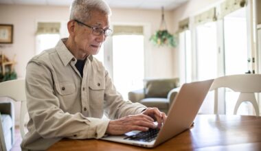 Adult typing on laptop.