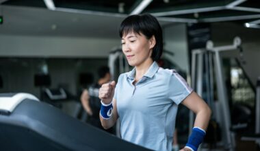 Woman doing incline walking workout at a gym