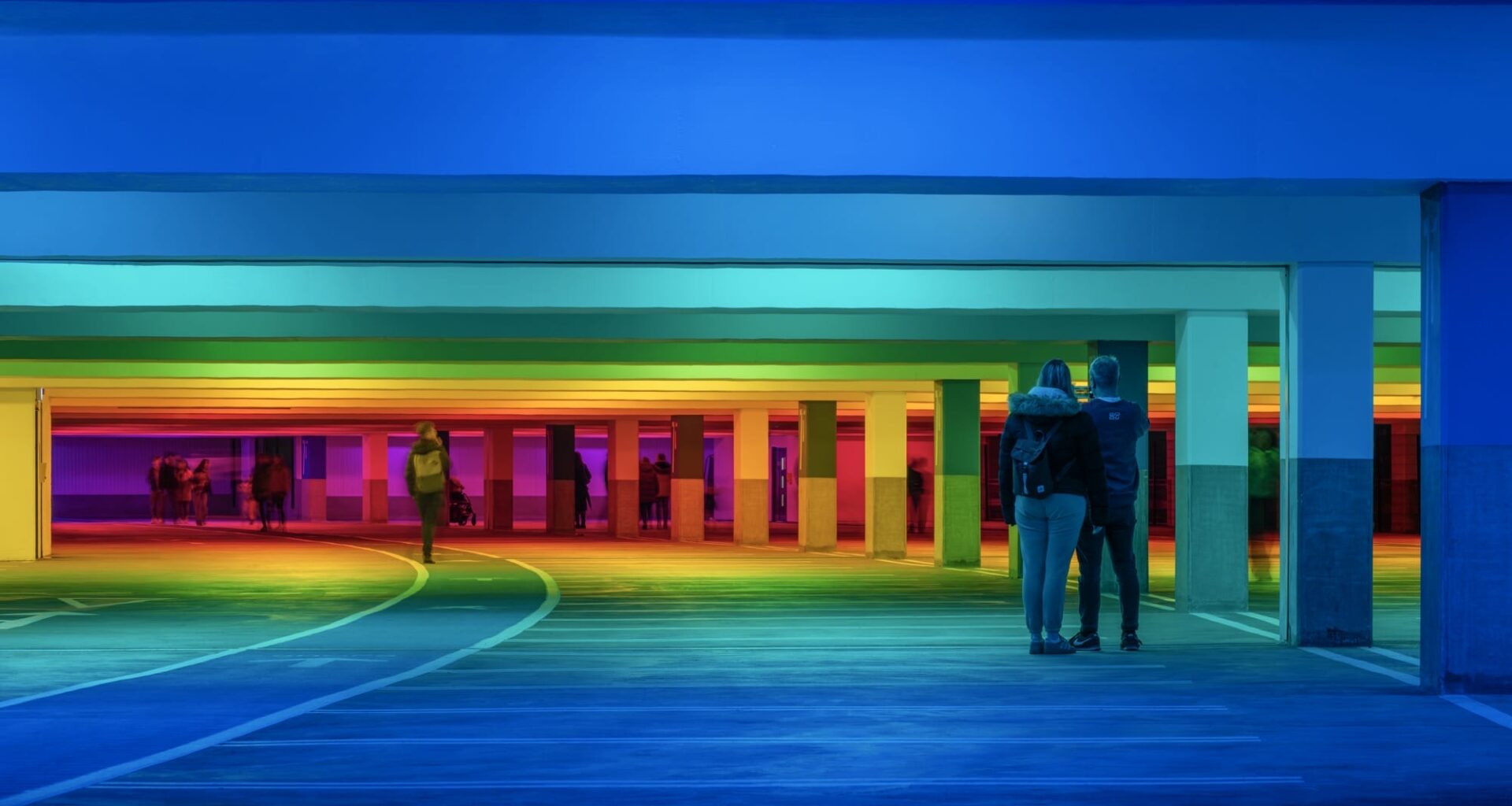 chromatic light blankets a parking garage by Liz West
