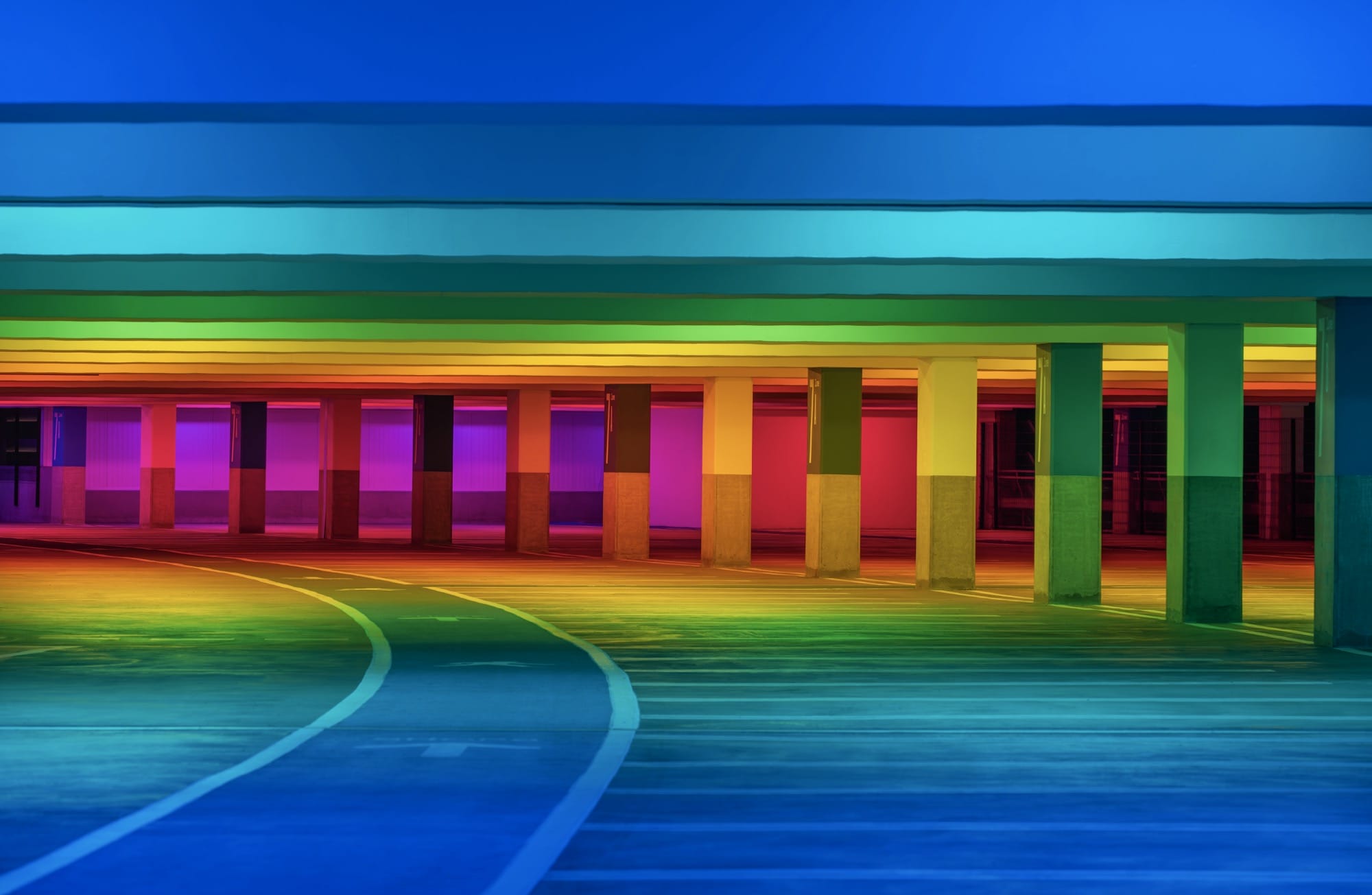chromatic light blankets a parking garage by Liz West