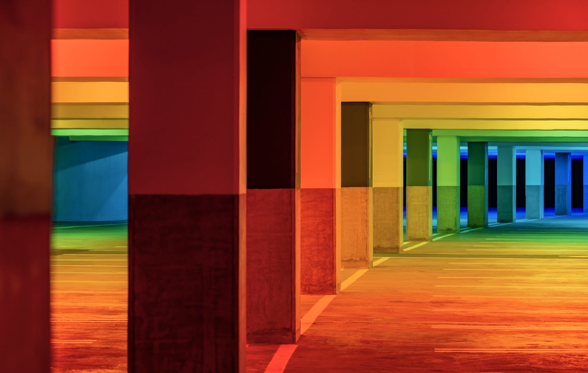 chromatic light blankets a parking garage by Liz West