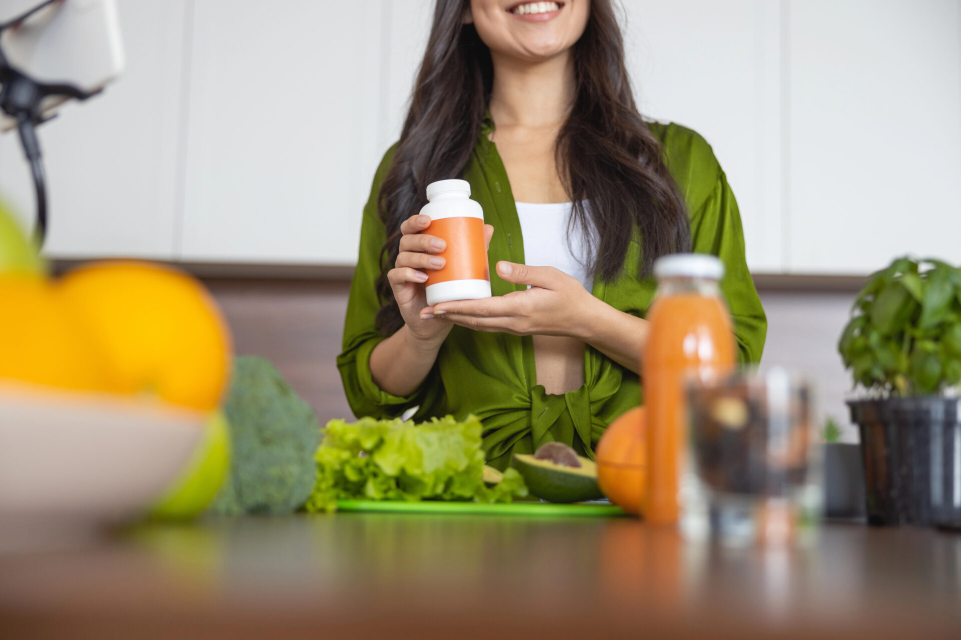 Woman holding multivitamins