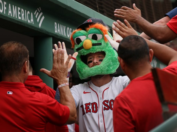 Trevor Story celebrates his home run win the dugout during the sixth inning of a game at Fenway Park earlier this summer. (Nancy Lane/Boston Herald)