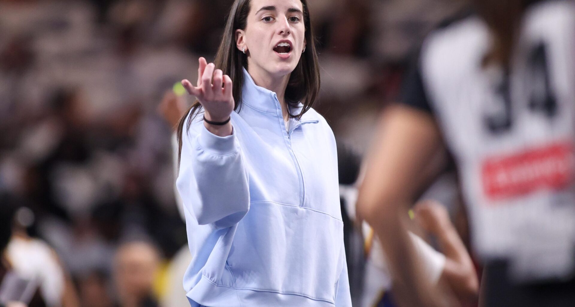 Indiana Fever guard Caitlin Clark on the sideline against the Atlanta Dream.