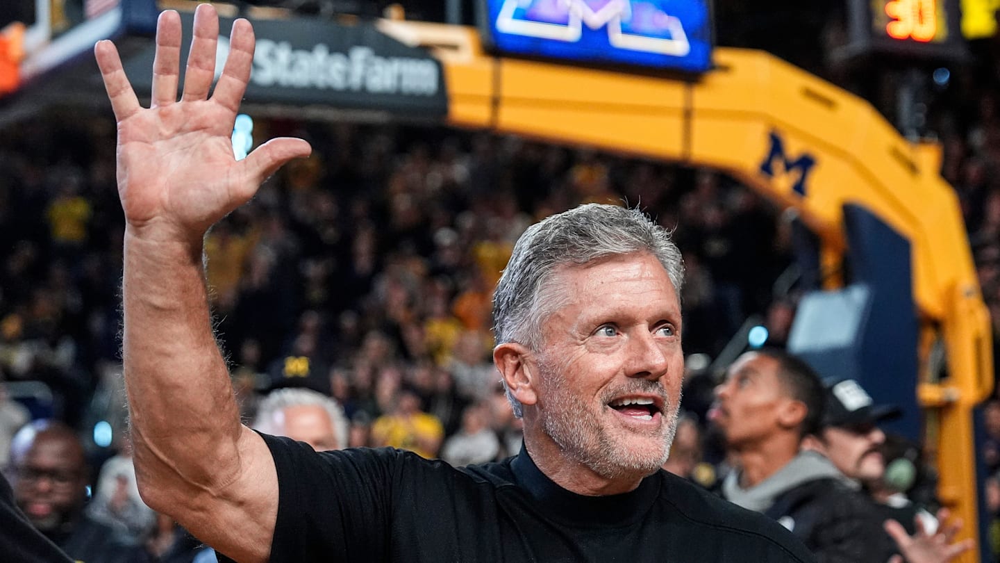Michigan football head coach Kyle Whittingham waves at the crowd as he is being introduced on the floor during the first half between Michigan and USC at Crisler Center in Ann Arbor on Friday, Jan. 2, 2026.