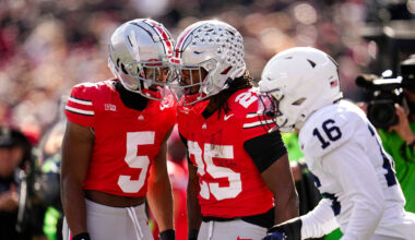 Ohio State Buckeyes wide receiver Mylan Graham (5) celebrates with running back Bo Jackson (25) beside Penn State Nittany Lions tight end Khalil Dinkins (16) during the NCAA football game at Ohio Stadium in Columbus on Nov. 1, 2025.