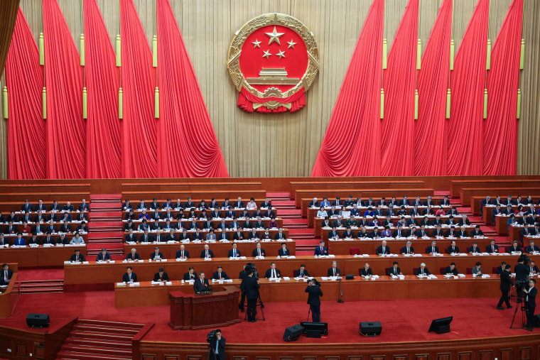 Chinese Premier Li Qiang delivers a work report during the opening session of the National People's Congress (NPC)  at the Great Hall of the People in Beijing.