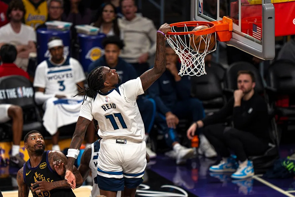 Minnesota Timberwolves center Naz Reid (11) backhanding a dunk during an NBA basketball game against the Los Angeles Lakers on March 10th, 2026 in Los Angeles, CA.