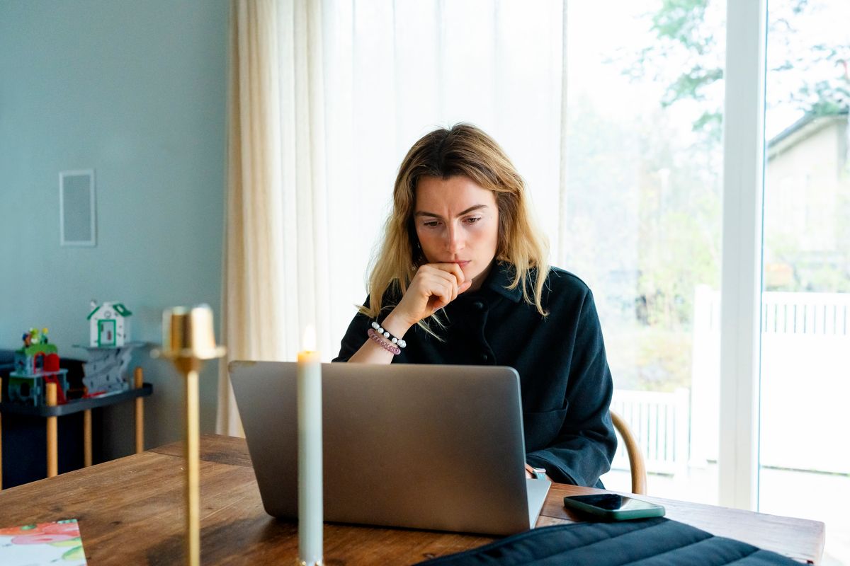 Woman looking at her laptop. 