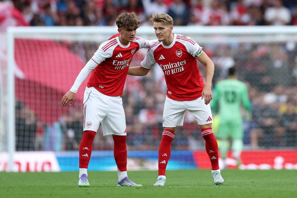 Martin Odegaard interacts with teammate Max Dowman during the pre-season friendly match between Arsenal and Villarreal at Emirates Stadium on August 06, 2025 in London, England.