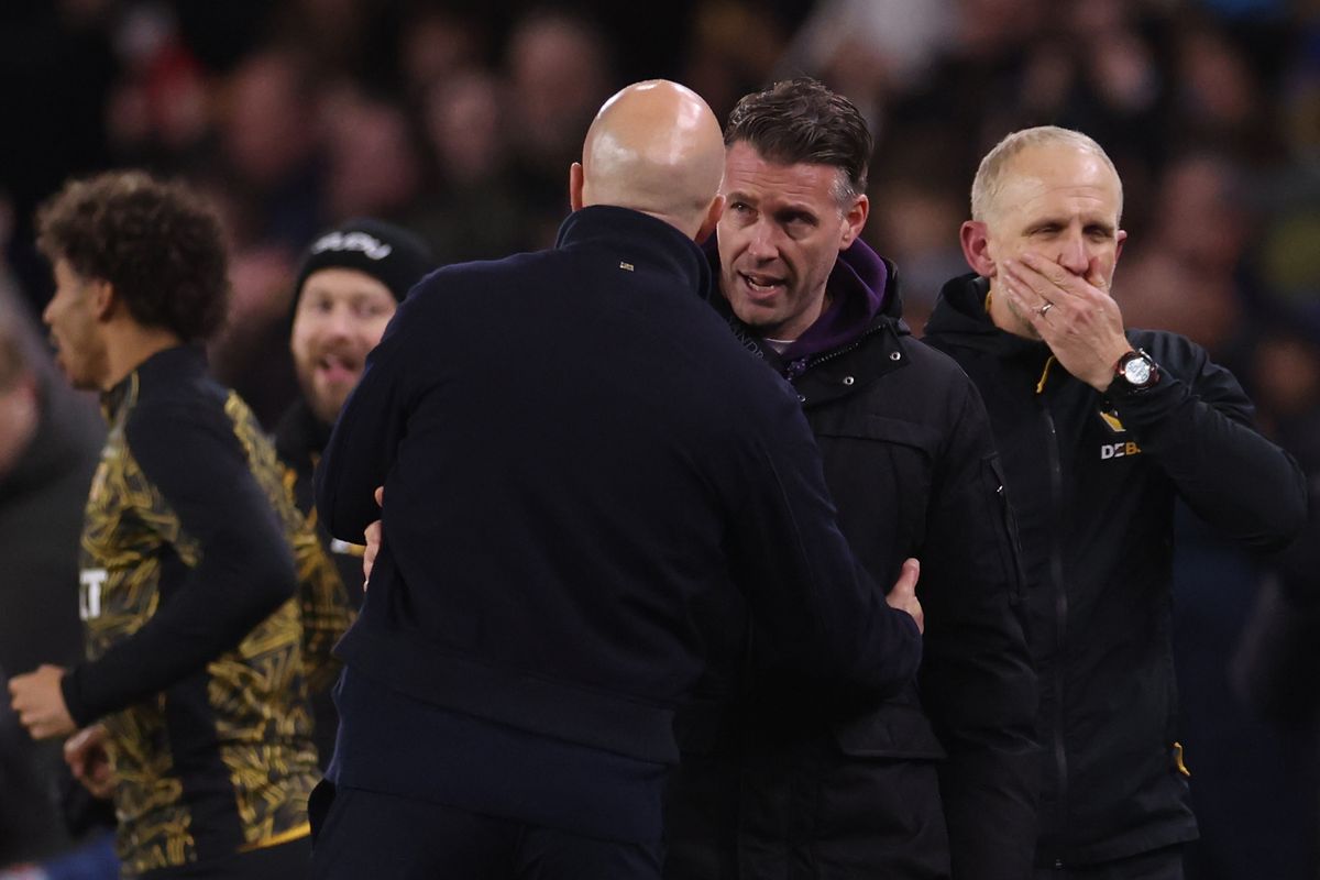WOLVERHAMPTON, ENGLAND - MARCH 03: Rob Edwards manager / head coach of Wolverhampton Wanderers with Arne Slot manager / head coach of Liverpool after the Premier League match between Wolverhampton Wanderers and Liverpool at Molineux on March 03, 2026 in Wolverhampton, England. (Photo by Catherine Ivill - AMA/Getty Images)