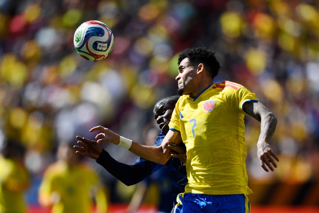 Luis Diaz of Colombia and N'Golo Kante of France compete for a header during the international friendly match between Colombia and France at Northwest Stadium on March 29, 2026 in Landover, Maryland