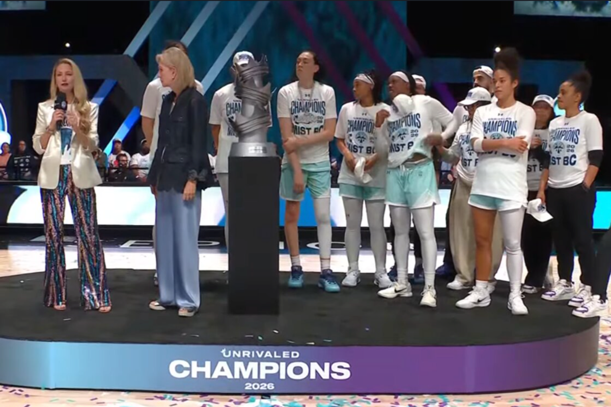 The 2026 Unrivaled Champion Mist celebrates during a trophy presentation 