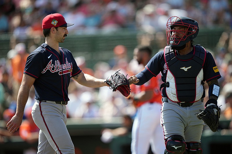 Atlanta Braves pitcher Spencer Strider and catcher Chadwick Tromp celebrate during a Grapefruit League exhibition game against the Baltimore Orioles at spring training on Feb. 28 in Sarasota, Fla. (AP Photo/Matt Slocum)