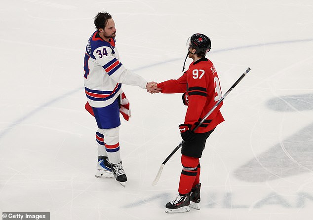 Matthews shakes hands with Connor McDavid after breaking Canadian hearts in Milan-Cortina