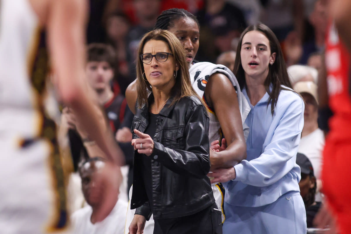 Indiana Fever head coach Stephanie White reacts after being called for a technical foul as forward Aliyah Boston (7) and guard Caitlin Clark (22) stand behind her.Brett Davis-Imagn Images