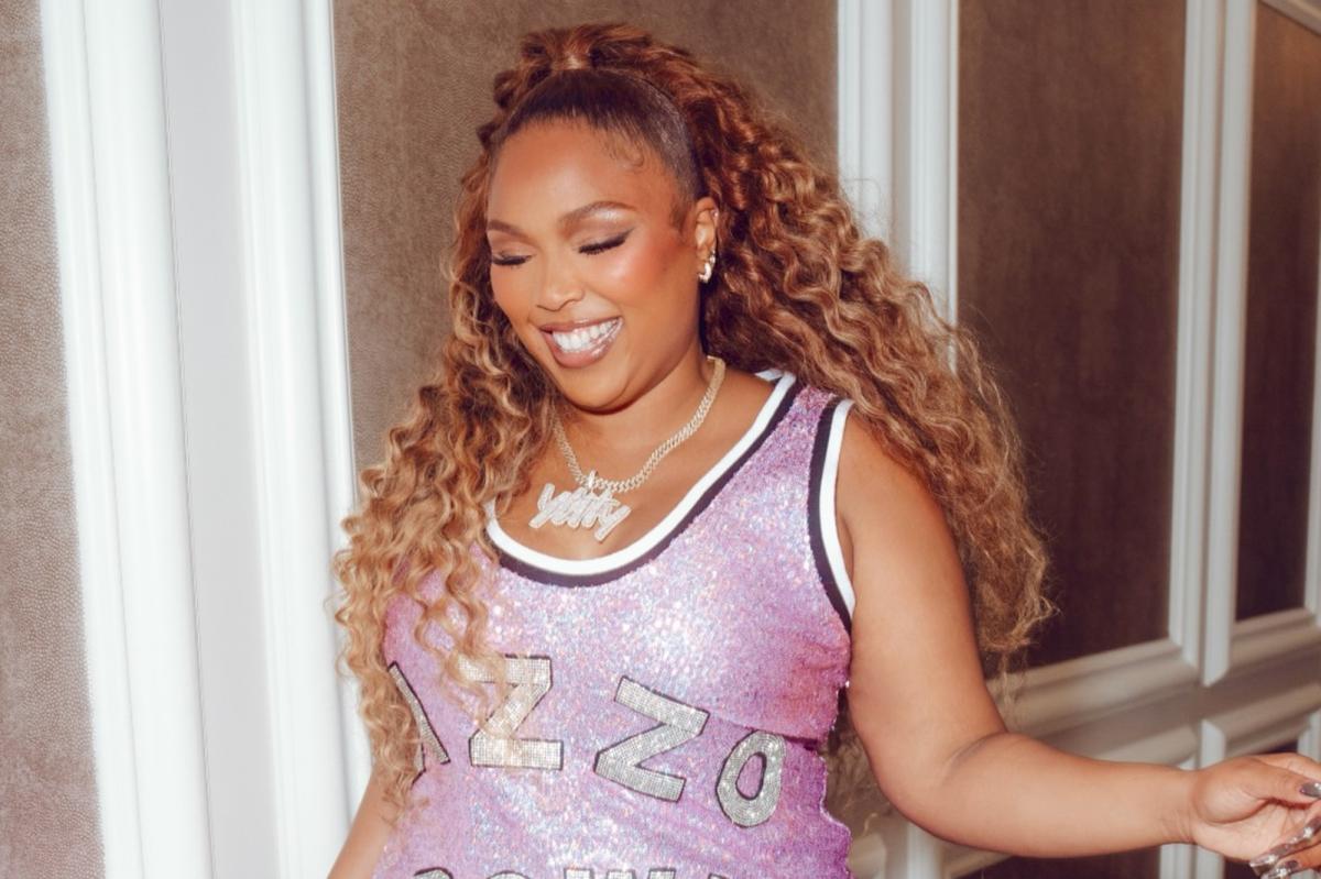 Lizzo flaunts staggering 60-pound weight loss in sparkly pink minidress