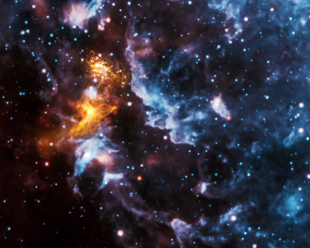 A pulsar, known as PSR B1509−58 lies at the heart of this nebula. X-rays from Chandra are gold; infrared from WISE in red, green and blue (Credit : NASA/CXC/SAO (X-Ray); NASA/JPL-Caltech (Infrared))