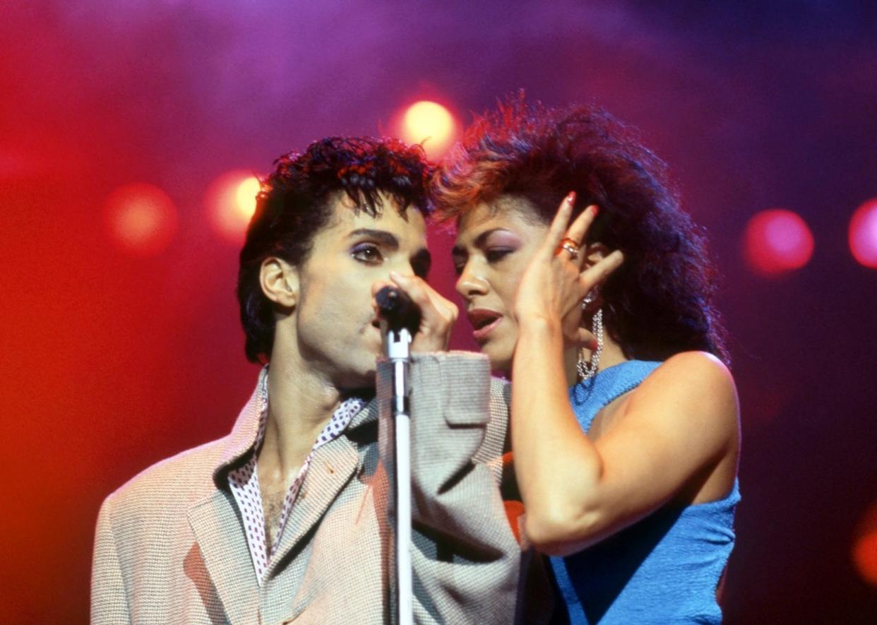 Prince with American singer Sheila E. on stage. - 