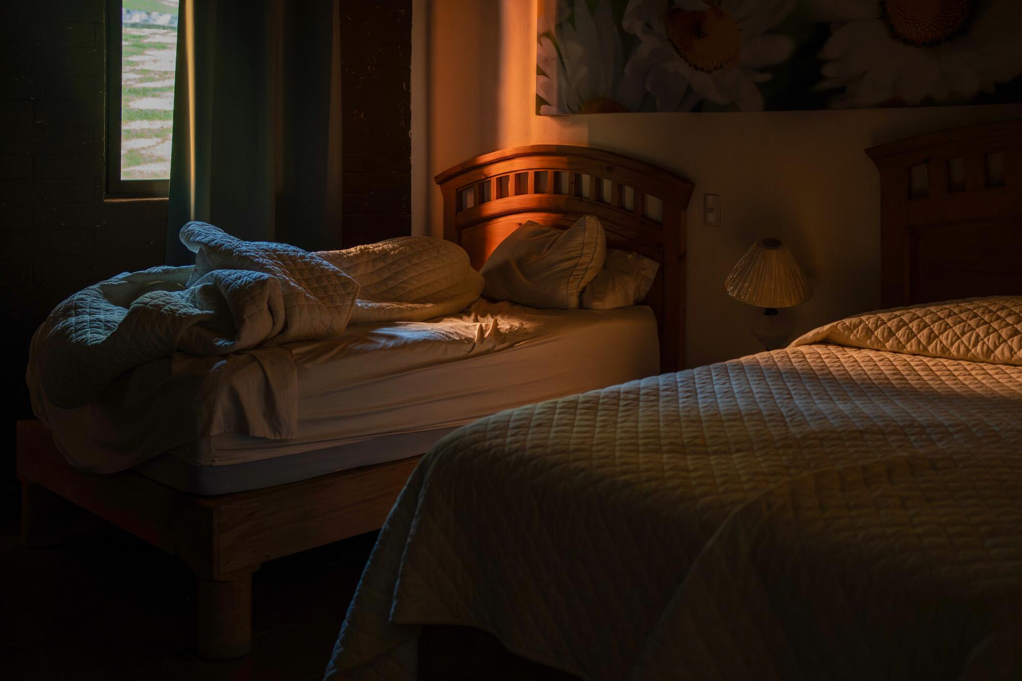 A ray of light in a bedroom.