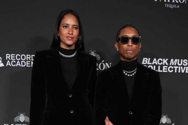 Helen Lasichanh, left, and Pharrell Williams attend the Recording Academy Honors presented by the Black Music Collective on Thursday, Jan. 29, 2026, in Los Angeles. (Photo by Richard Shotwell/Invision/AP)