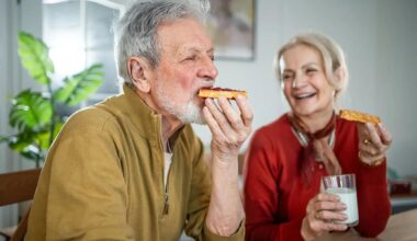 Nurse helping a senior woman walking up the stairs