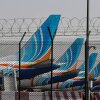 FlyDubai airline planes are parked at Dubai International Airport on Monday. Several Persian Gulf airlines — including those based in Dubai and Abu Dhabi in the United Arab Emirates, Doha in Qatar and others — have curtailed commercial flights for safety reasons following the expanding U.S. and Israeli bombardment in Iran.