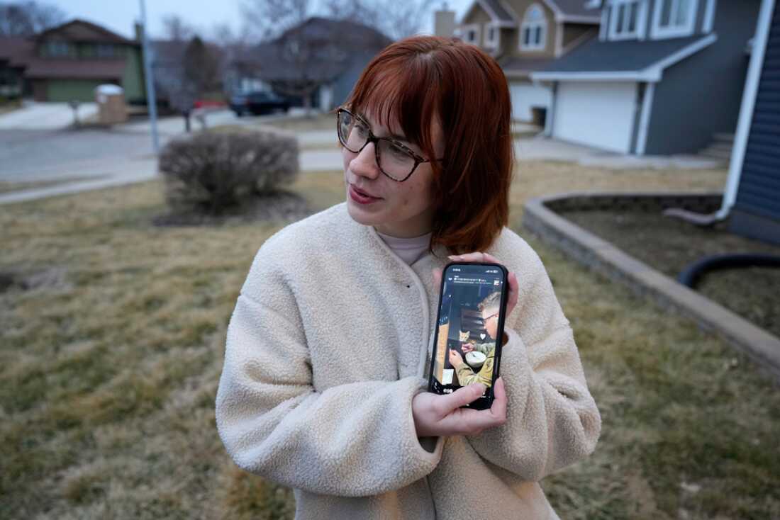 Keira Coady holds a photo of her brother, Sgt. Declan Coady, 20, outside her home Tuesday in West Des Moines, Iowa.