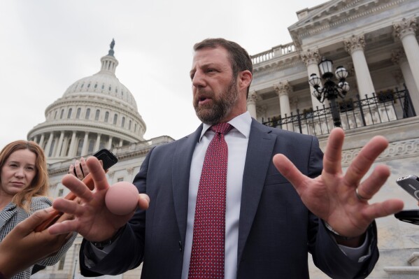 Sen. Markwayne Mullin, R-Okla., speaks with reporters on the steps at the Capitol in Washington, Thursday, March 5, 2026. (AP Photo/J. Scott Applewhite)