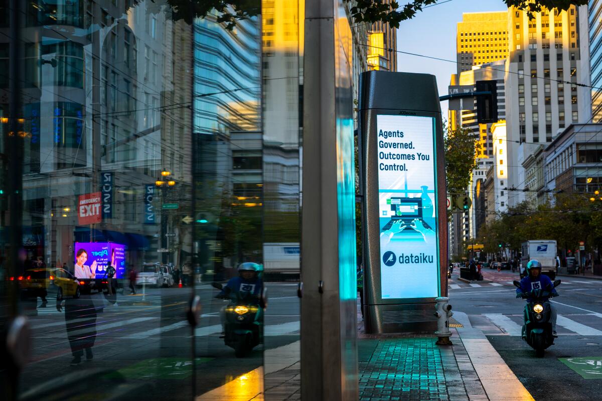 An advertisement promoting an AI-powered company is seen downtown