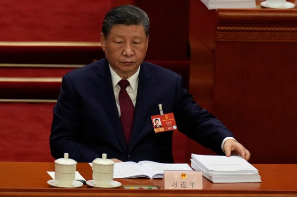 Chinese President Xi Jinping reacts during the opening session of the National People's Congress (NPC) in Beijing, Thursday, March 5, 2026. (AP Photo/Ng Han Guan)