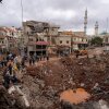 People inspect the damage where Israel's military carried out an airborne operation that dropped troops overnight, in the town of Nabi Chit, Lebanon.