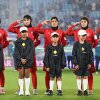 FILE - Iran players react during their national anthem ahead of the Women's Asian Cup soccer match between Iran and the Philippines in Robina, Australia, Sunday, March 8, 2026