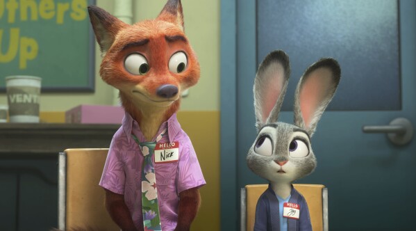 This image released by Disney shows Nick Wilde, voiced by Jason Bateman, left, and Judy Hopps, voiced by Ginnifer Goodwin, in a scene from "Zootopia 2." (Disney via AP)