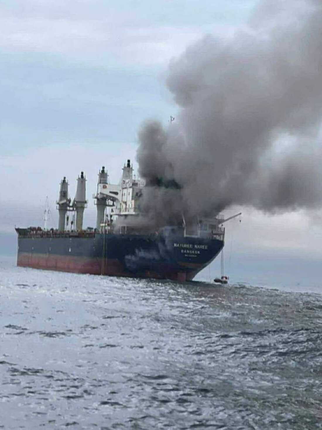 This image released by the Royal Thai Navy shows Thai cargo ship, Mayuree Naree, that was struck and set ablaze in the Strait of Hormuz Wednesday.