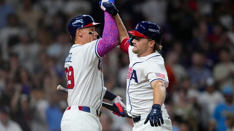 United States shortstop Gunnar Henderson, right, celebrates with right fielder...