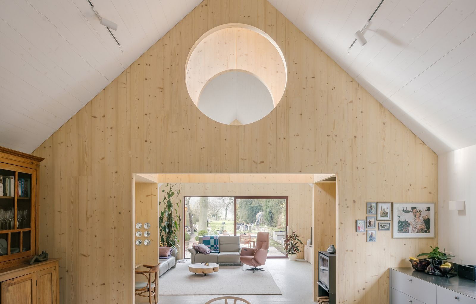 Timber Structures Pull Triple Duty Inside This Belgian Home for a Retired Couple