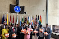 Dallas Mayor Eric Johnson (center) and other city and Dallas Wings officials held a news...