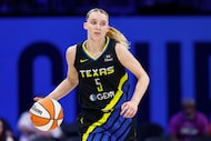Dallas Wings guard Paige Bueckers (5) dribbles the ball during the third quarter of a WNBA...
